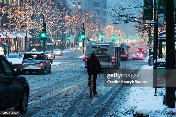 winter in chicago - biker on michigan avenue - michigan avenue chicago ストックフォトと画像