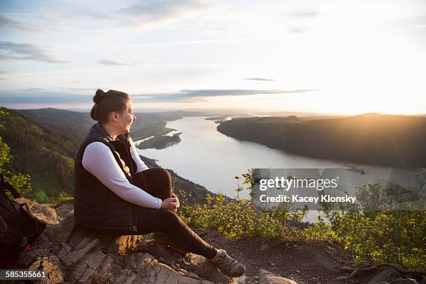 woman enjoying view on hill, angels rest, columbia river gorge, oregon, usa - columbia gorge ストックフォトと画像