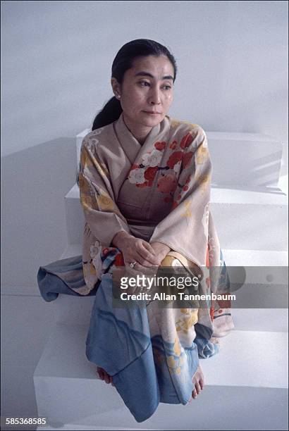 Portrait of Japanese-born artist and musician Yoko Ono, dressed in a kimono, as she sits on a step in a SoHo gallery, New York, New York, November...