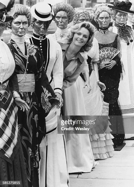Actress Lee Remick standing in between mannequins wearing some of the costumes she wears in the television show 'Jennie: Lady Randolph Churchill', at...