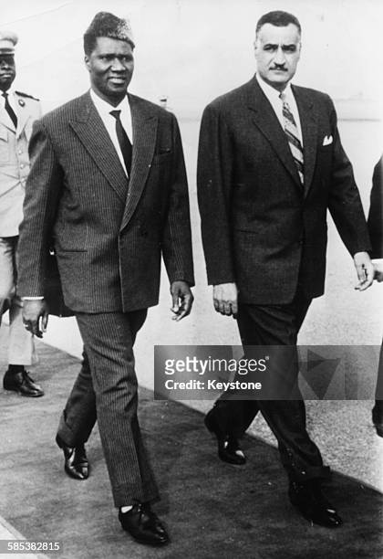Ahmed Sekou Toure , President of Guinea, walking with Egyptian President Gamal Abdel Nasser at Cairo Airport, circa 1965.