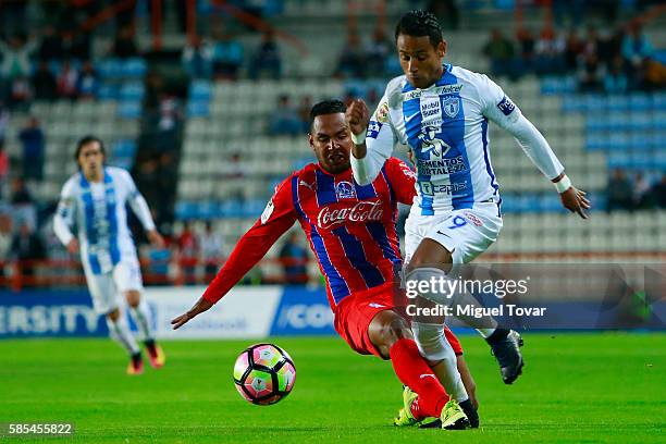 Wilson Moreno of Pachuca fights for the ball with Jose Tobias of Olimpia during a match between Pachuca and Olimpia as part of Liga de Campeones...