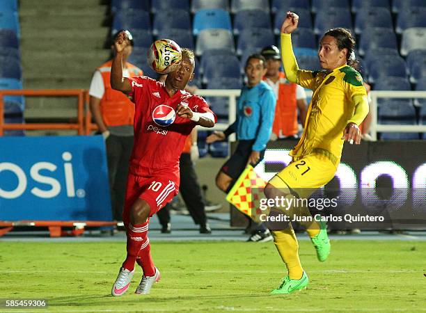 Brayan Angulo of America fights for the ball with Diego Sanchez of Leones during a match between America de Cali and Leones as part of round 5 of...