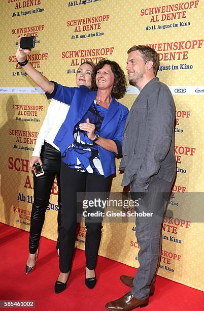 Lisa Maria Potthoff, Ilse Aigner and Sebastian Bezzel taking a selfie during the premiere of the film 'Schweinskopf al dente' at Mathaeser Filmpalast...