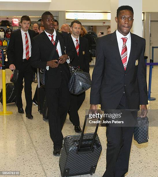 Michael Carrick, Paul Pogba, Ryan Giggs and Danny Welbeck of Manchester United arrive at Manchester Airport en route to Bilbao, ahead of the UEFA...