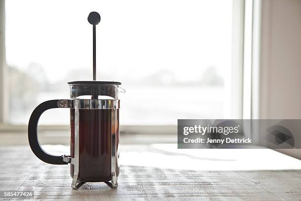 coffee plunger on table - cafetiere stock pictures, royalty-free photos & images