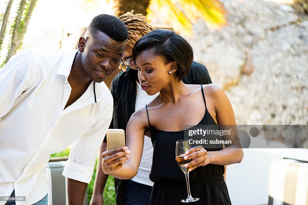 Woman Showing Her Friend Her Mobile Phone