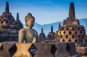 Ancient Buddha statue and stupa at Borobudur temple