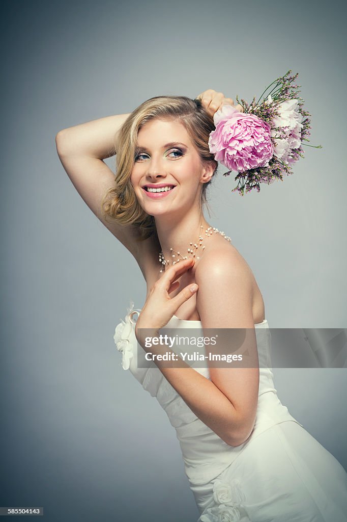 Waist up portrait of beautiful blond bride