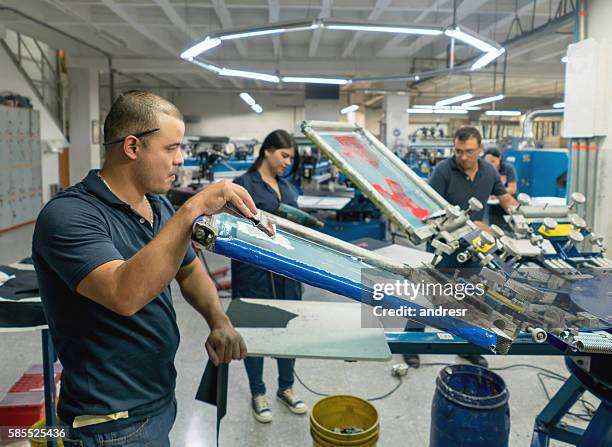 man textile printing at a factory - textile printing stock pictures, royalty-free photos & images