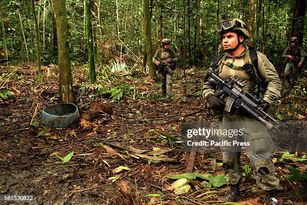 Colombian anti-drug police during operation of destroying cocaine processing labs at the jungle in Guaviare state.