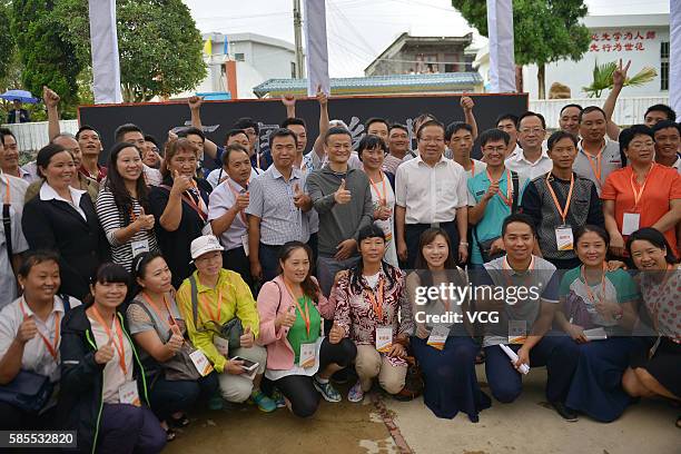 Alibaba Group Chairman Jack Ma take photos with rural headmasters and teachers during the first training class of Jack Ma Foundation Rural Teachers...