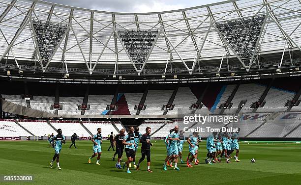 West Ham United players warm up during their training session at Queen Elizabeth Olympic Park on August 3, 2016 in London, England. .