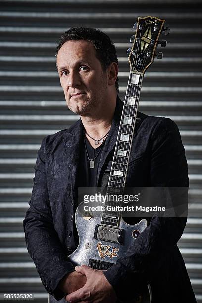 Portrait of Northern Irish musician Vivian Campbell, guitarist with hard rock group Def Leppard, photographed backstage before a live performance at...