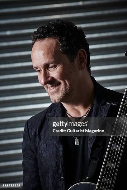 Portrait of Northern Irish musician Vivian Campbell, guitarist with hard rock group Def Leppard, photographed backstage before a live performance at...
