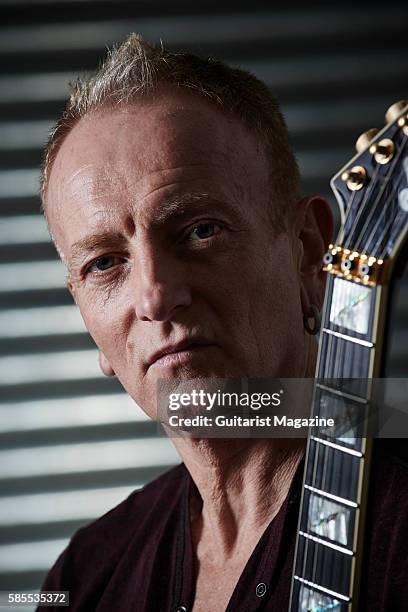 Portrait of English musician Phil Collen, guitarist with hard rock group Def Leppard, photographed backstage before a live performance at the...