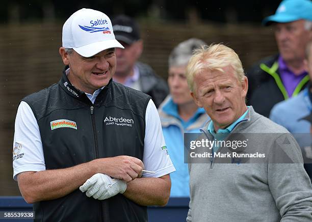 Paul Lawrie , of Scotland talks with Gordon Strachan, manager of the Scotland national football team, during the Aberdeen Asset Management Paul...
