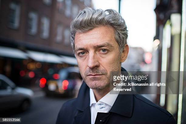 serious business man street portrait - jc bonassin stock pictures, royalty-free photos & images