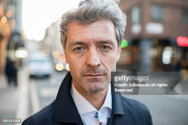 serious business man street portrait - jc bonassin stock pictures, royalty-free photos & images