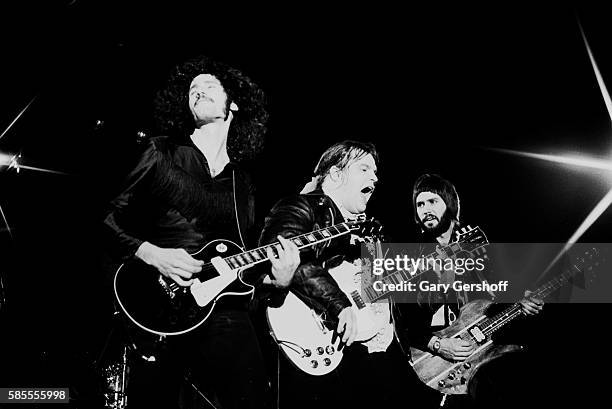 American musician Meat Loaf performs onstage with his band, Neverland Express, who include sibling guitarists Bruce and Bob Kulick, during a...