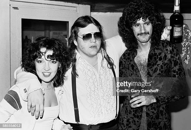Portrait of, from left, musicians Karla DeVito, Meat Loaf, and Bruce Kulick as they pose backstage at My Father's Place nightclub, Roslyn, New York,...