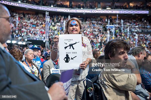 Delegate shows a gun control sign on floor of the the Wells Fargo Center in Philadelphia, Pa., on the third day of the Democratic National...
