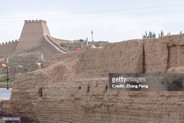 Rammed earth wall and fort in Jiayu Pass. Jiayu Pass is the first pass at the west end of the Great Wall and is the most intact surviving ancient...