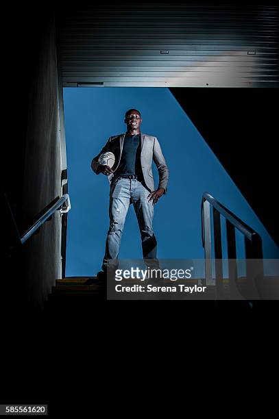 Mohamed Diame poses for a photograph at the top of some steps whilst holding a football at St.James' Park on August 2 in Newcastle upon Tyne, England.