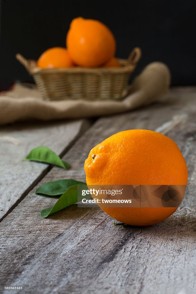 Fresh oranges on wooden background