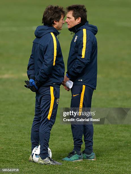 Gustavo and Guillermo Barros Schelotto look on during a Boca Juniors Training Session at Alberto J. Armando Stadium on August 02, 2016 in Buenos...