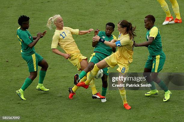 Lebohang Ramalepe of South Africa battles with Caroline Seger and Lotta Schelin during the Women's Group E first round match between Sweden and South...
