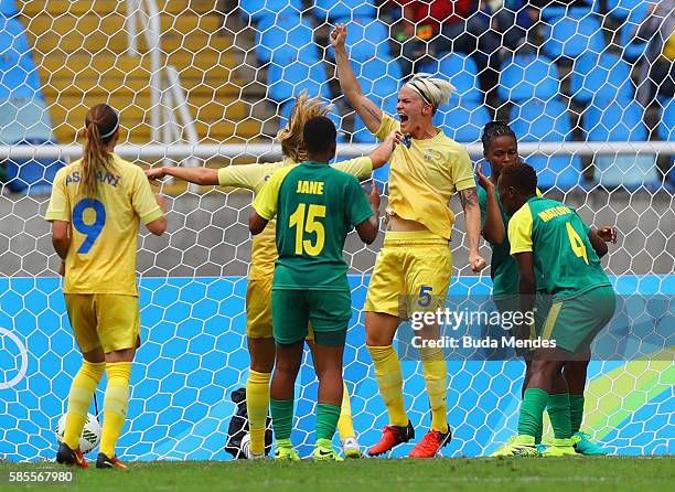 Nilla Fischer of Sweden celebrates after scoring while Refiloe Jane and Noko Matlou of South Africa watch during the Women's Group E first round...