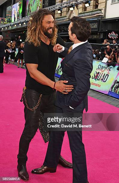 Jason Momoa and Henry Cavill attend the European Premiere of "Suicide Squad" at Odeon Leicester Square on August 3, 2016 in London, England.