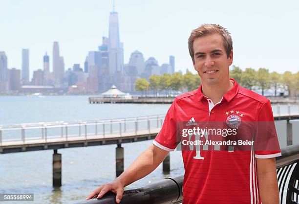 Philipp Lahm of FC Bayern Muenchen smiles in front of New York's skyline during the AUDI Summer Tour USA 2016 on August 3, 2016 in Hoboken, United...