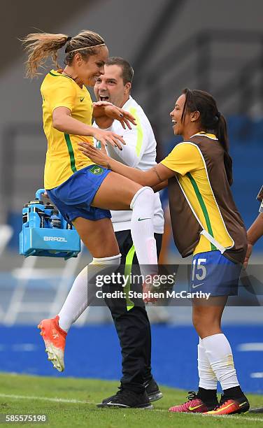 Rio , Brazil - 3 August 2016; Monica of Brazil celebrates with team-mate Raquel Fernandes after scoring her side's first goal of the game during the...