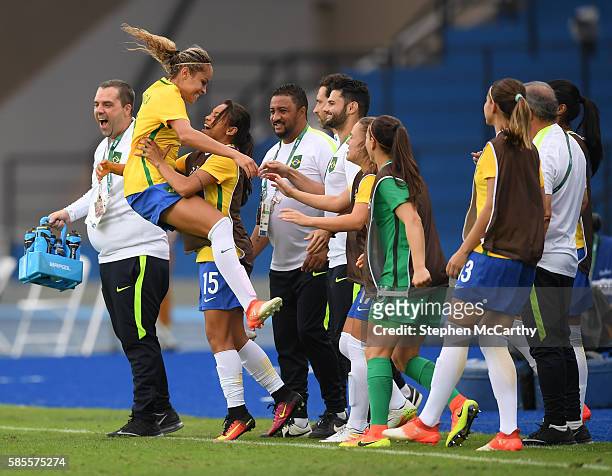 Rio , Brazil - 3 August 2016; Monica of Brazil celebrates with team-mate Raquel Fernandes after scoring her side's first goal of the game during the...