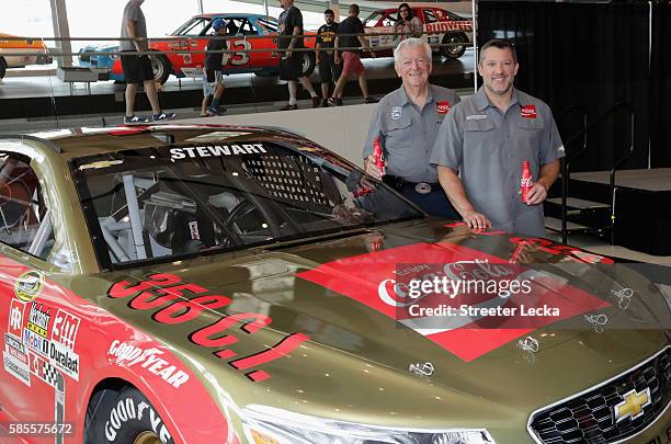 Bobby Allison and Tony Stewart pose with the car's new paint scheme during the No. 14 Darlington Throwback Announcement True Speed Press Conference...