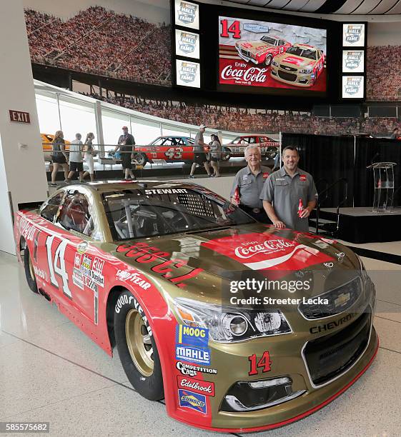 Bobby Allison and Tony Stewart pose with the car's new paint scheme during the No. 14 Darlington Throwback Announcement True Speed Press Conference...