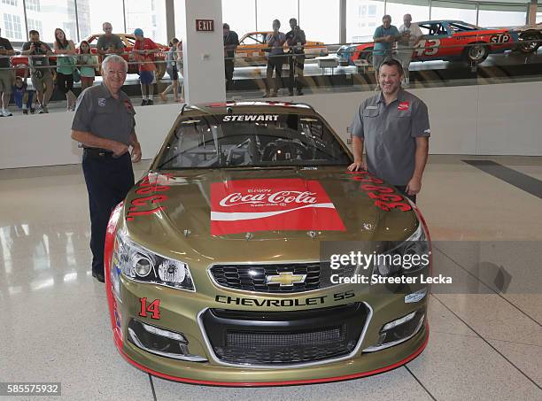 Bobby Allison and Tony Stewart pose with the car's new paint scheme during the No. 14 Darlington Throwback Announcement True Speed Press Conference...