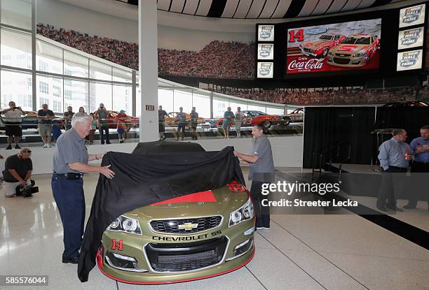 Bobby Allison and Tony Stewart reveal the car's new paint scheme during the No. 14 Darlington Throwback Announcement True Speed Press Conference at...