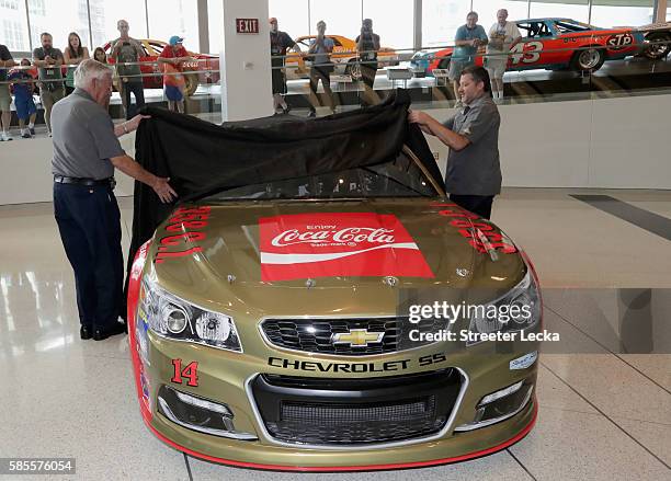 Bobby Allison and Tony Stewart reveal the car's new paint scheme during the No. 14 Darlington Throwback Announcement True Speed Press Conference at...