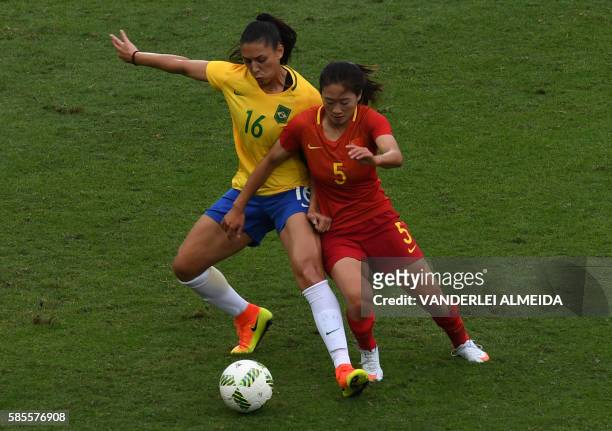 Brazilian player Beatriz tries to control the ball marked by China player Wu Haiyan during the Rio 2016 Olympic Games womens First Round Group E...