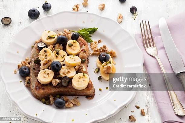 french toast with bananas - blaubeeren stock pictures, royalty-free photos & images