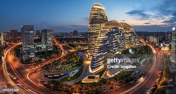 the chinese city and the famous landmark building, wangjing soho's night. - prosperity stock pictures, royalty-free photos & images