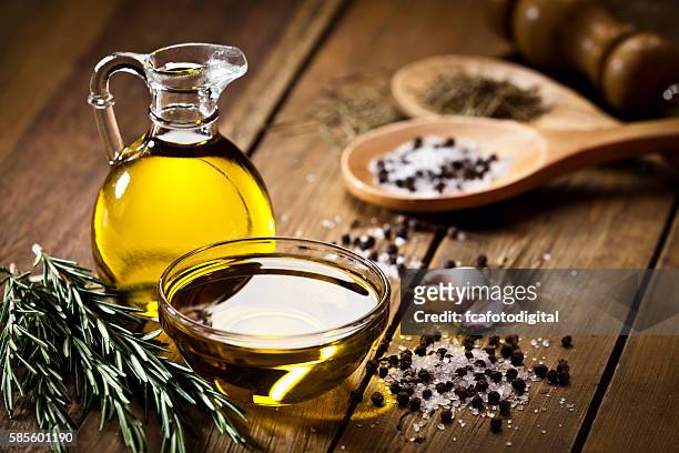 flavoring: olive oil, garlic, pepper, salt and rosemary - salad dressing stock pictures, royalty-free photos & images