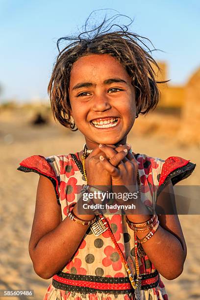 portrait of happy indian little girl, desert village, rajasthan, india. - rajasthani youth stock pictures, royalty-free photos & images