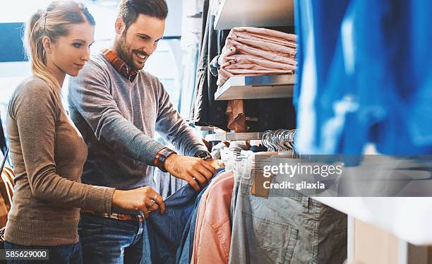 buying clothes at a mall. - fun lovers unite stock pictures, royalty-free photos & images