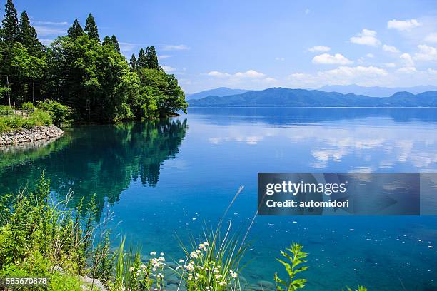 reflection on lake tazawa (tazawako) in akita, japan - akita prefecture stock pictures, royalty-free photos & images