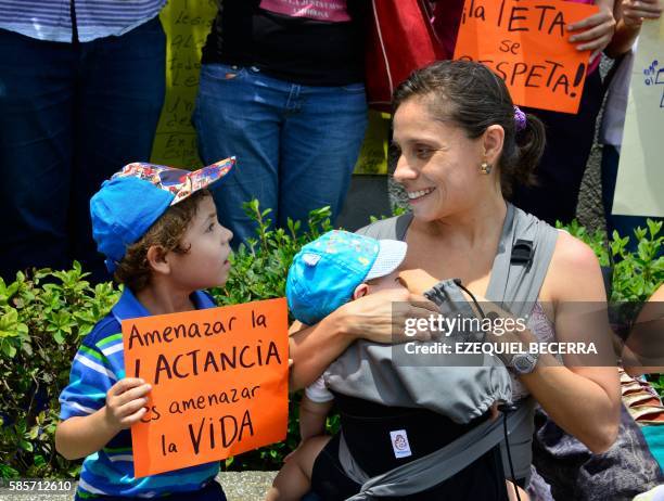 Women --some of them breastfeeding-- carry out a "mamaton" outside the Legislative Assembly in San Jose on August 3, 2016 protesting against the...