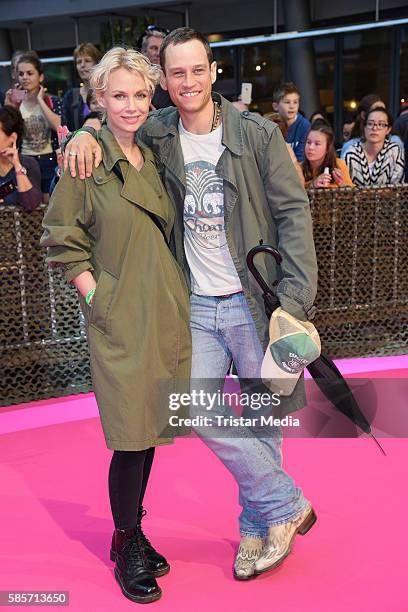 German actor Vinzenz Kiefer and his wife Masha Tokareva attend the Suicide Squad Live Event at CineStar on August 3, 2016 in Berlin, Germany.